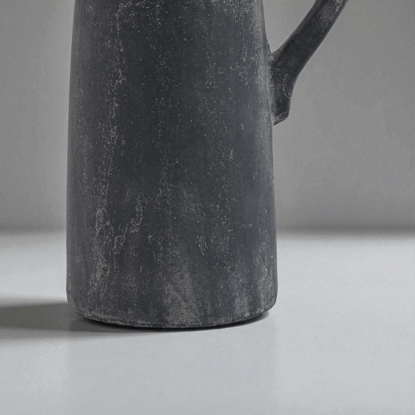 Sculptural grey tall jug with Mediterranean influences, ideal for modern display in home decor.