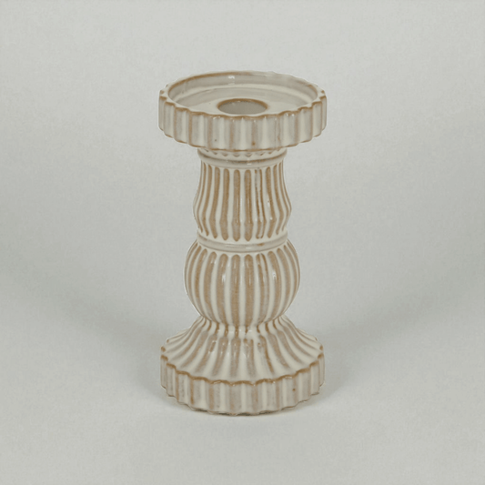 Alora ceramic pillar candle holder in white, showcasing ridged design for elegant display and ambient light effects.