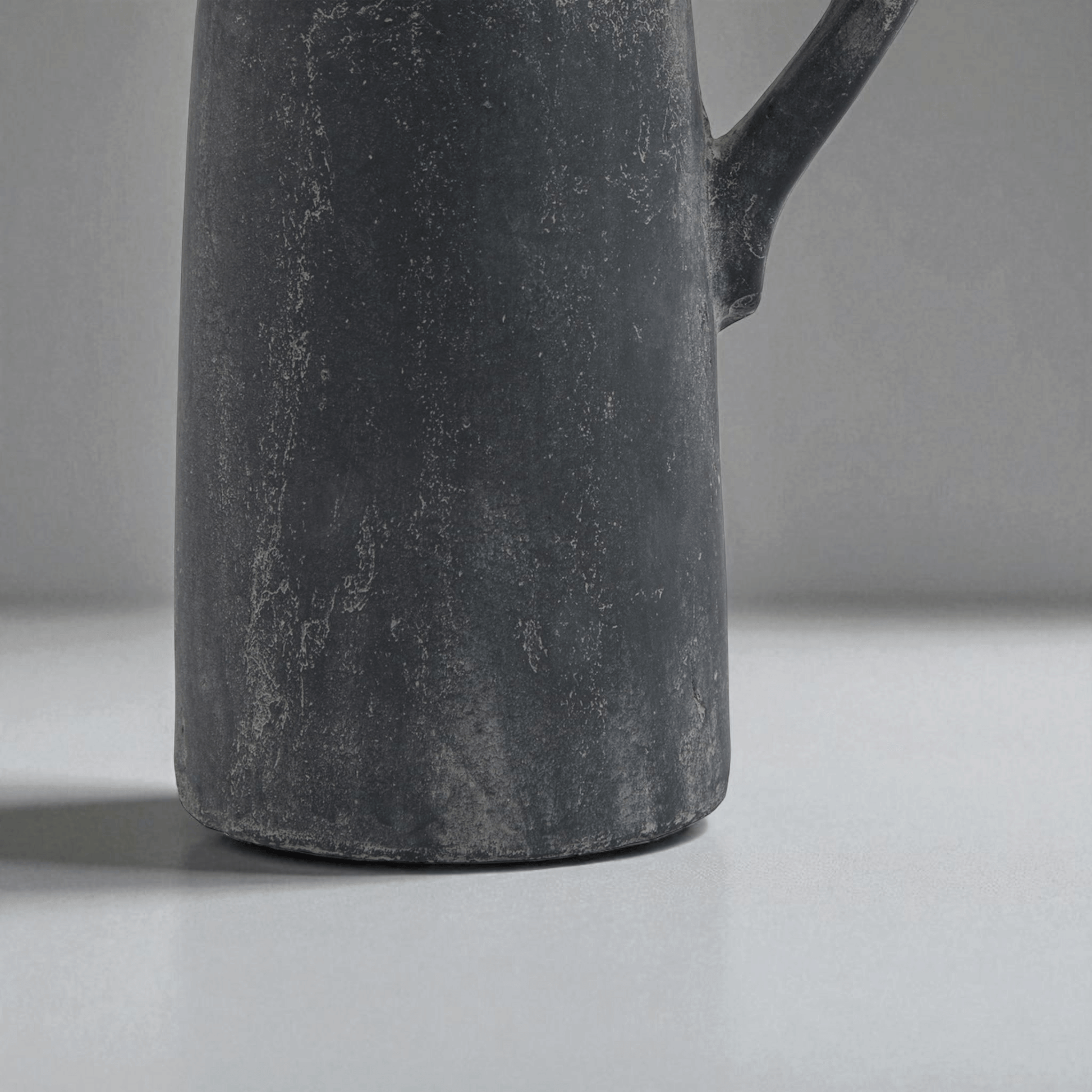 Sculptural grey tall jug with Mediterranean influences, ideal for modern display in home decor.