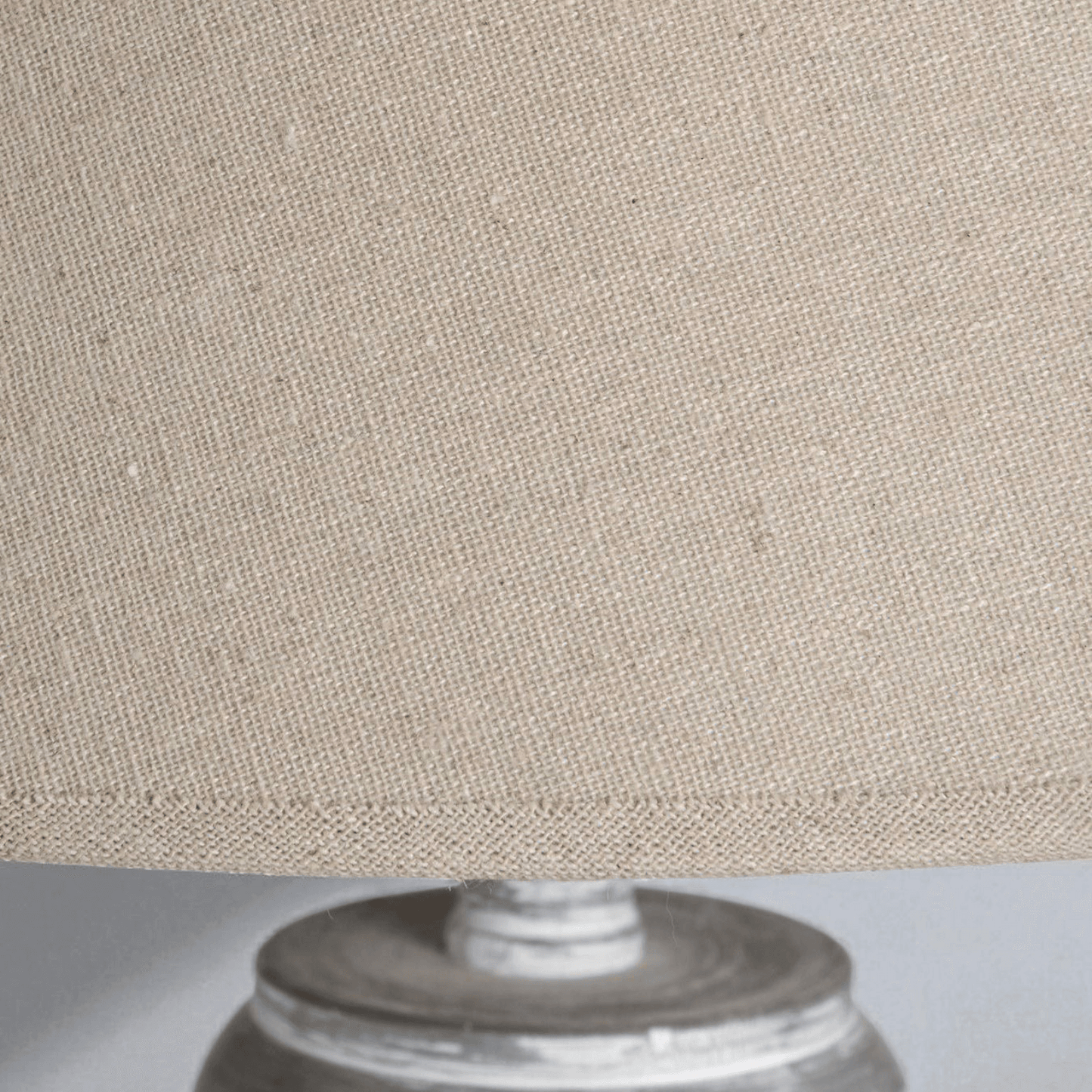 Close-up of the linen shade of the Ithaca Floor Lamp, showcasing its texture and design details in a rustic style.