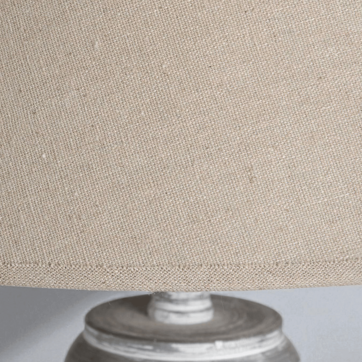 Close-up of the linen shade of the Ithaca Floor Lamp, showcasing its texture and design details in a rustic style.