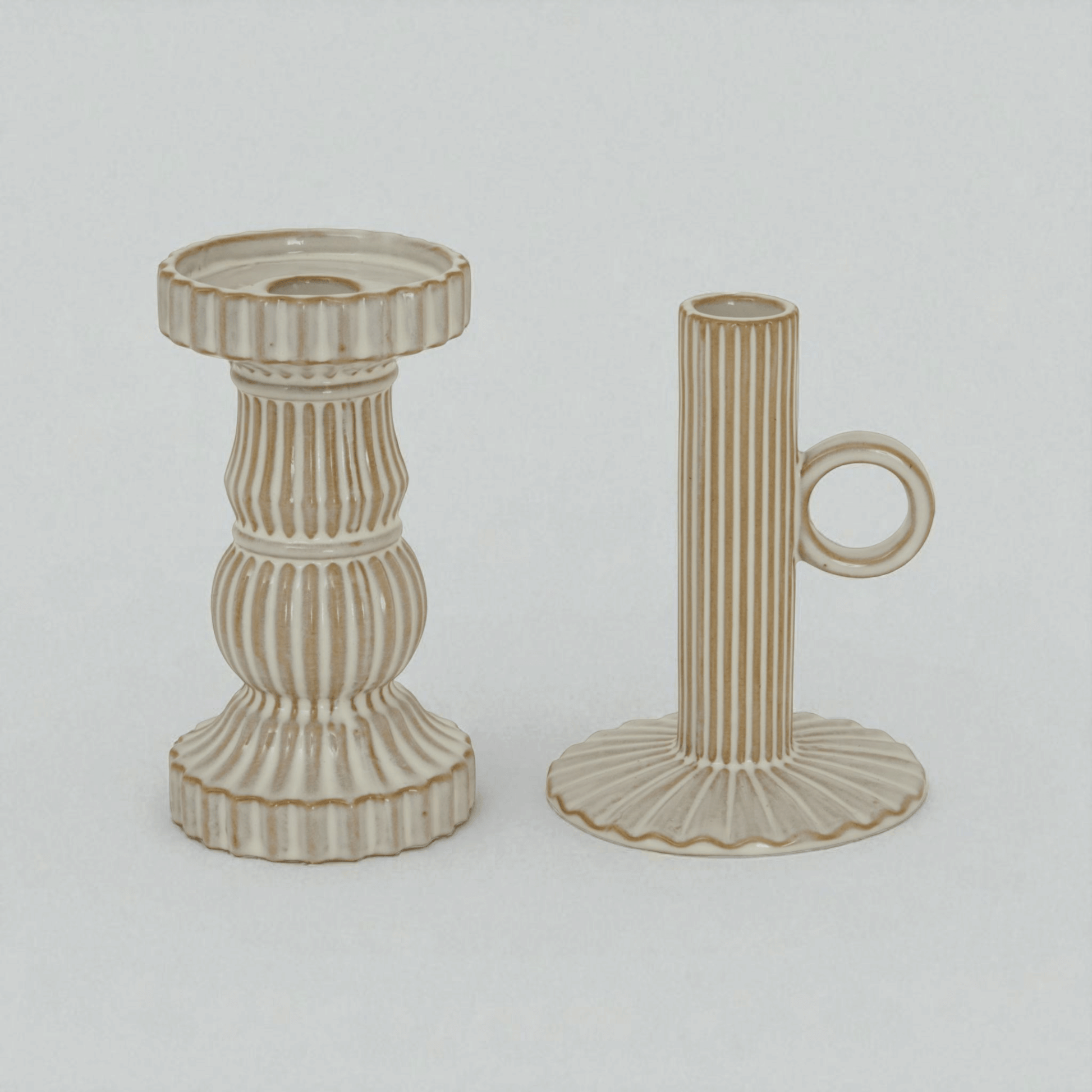 Alora ceramic pillar candle holders in white, showcasing elegant design with stunning light effects and stable bases.