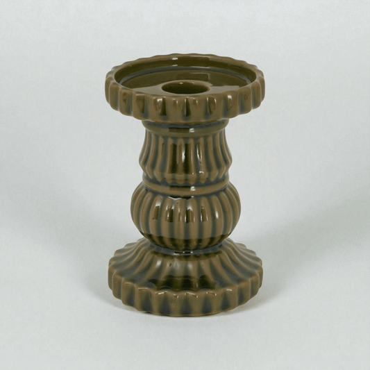 Contemporary olive ceramic pillar candle holder, perfect for modern decor, adding Mediterranean charm to any room.